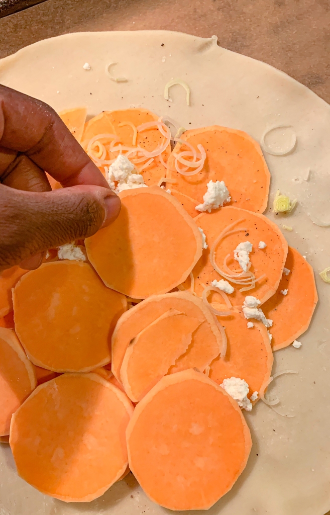 Repeat layers of sweet potatoes, seasonings, leeks and cheese